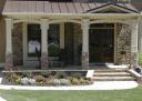 Archs cut from heavy cedar timbers adorn these columns