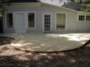 Curved deck directly on the ground adds to the back yard Garden Feel