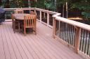 This is an example of redecking with “Trex” and adding “Deckorator” Metal Ballusters on Cedar rail. Notice our signature “Rail Cap Shelf”
