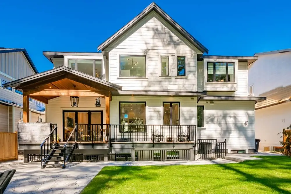 Classic home exterior with cement tile patio deck