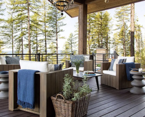 A beautiful modern home with a spacious covered porch, offering outdoor living space and protection.
